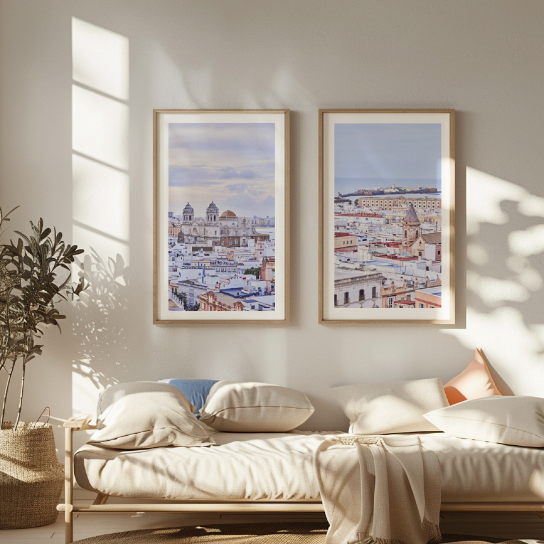 A living room with a set of two photgraphs of Cadiz on the wall